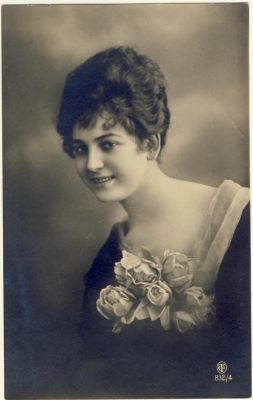 Woman with curly hair and flowers