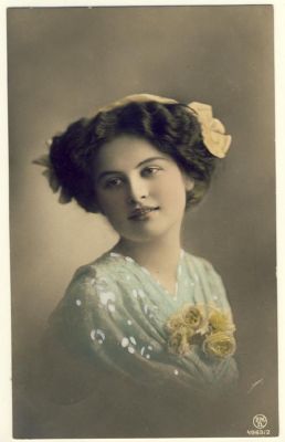 Woman with curly hair and hair ribbon