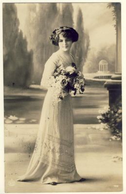Woman with dress and flowers standing