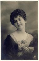 Woman looking wishful with flowers