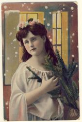 Woman with long hair and fir branches