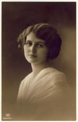 Woman looking wishful with curly hair