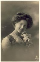 Woman with curly hair and flowers